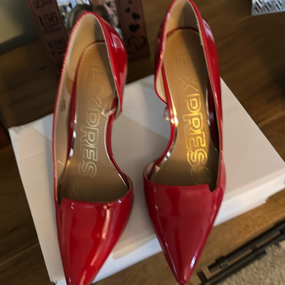 Red stiletto pointy toed heels